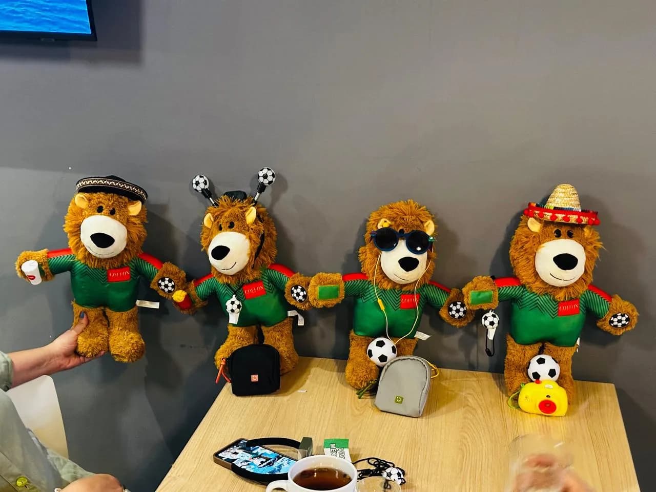 The first Goleón plush lions on a café table, June 2026