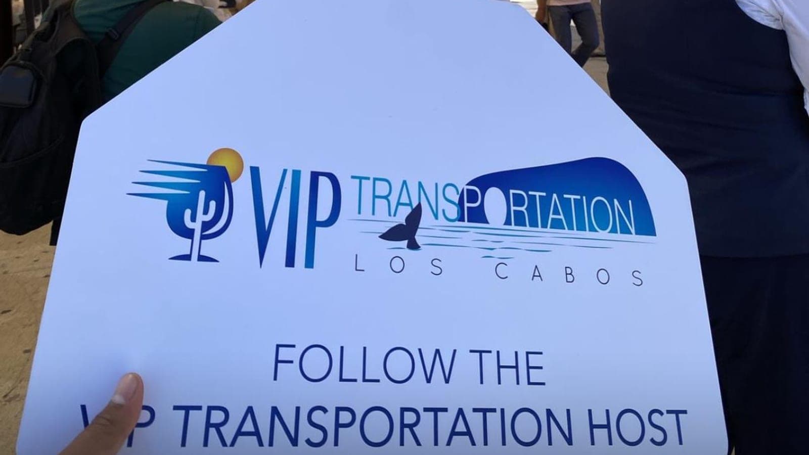 Host holding the VIP sign